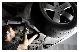 Machanic Repairing Under Car